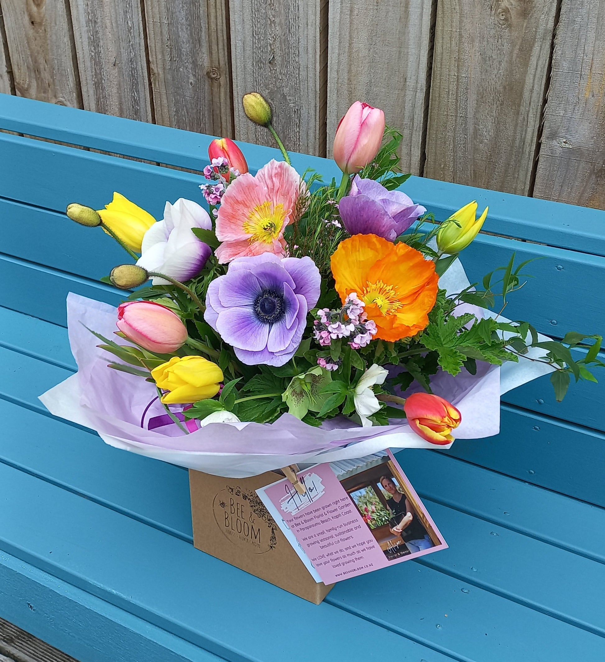 Colorful bouquet of flowers on a blue door