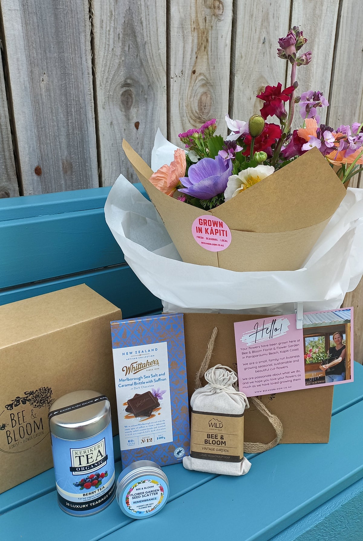 gift box with treats and fresh flowers